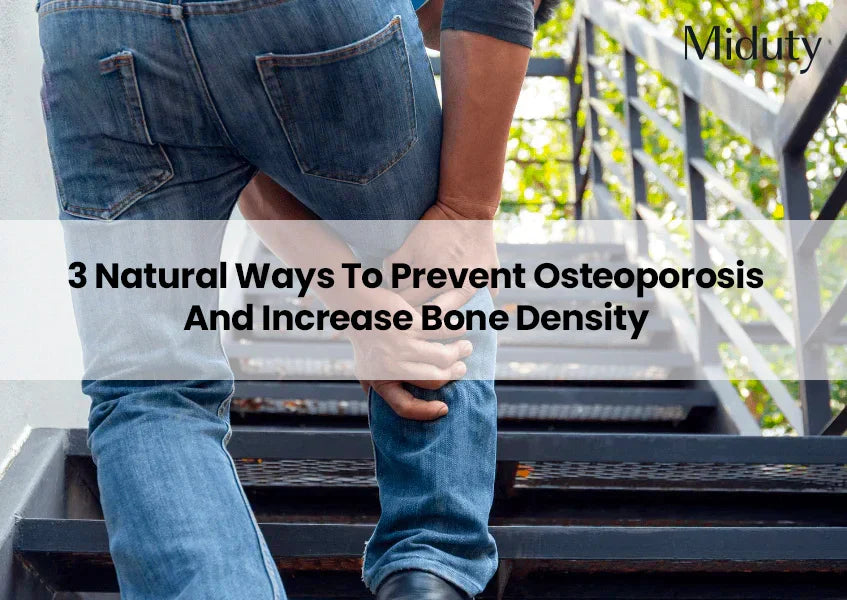 Person holding their knee while walking up stairs, reflecting concerns about bone health.