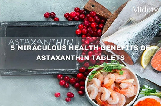 Astaxanthin tablets with seafood and fresh ingredients on a gray background