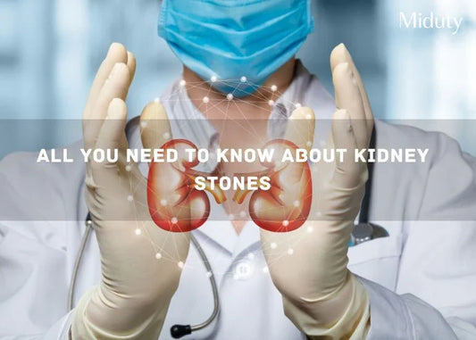 Medical professional holding hands in kidney shape with a blue background