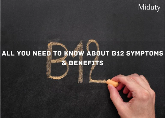 Hand writing 'B12 Symptoms & Benefits' on a blackboard