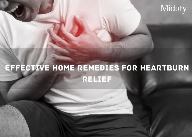 Person holding their chest in discomfort while sitting on a couch