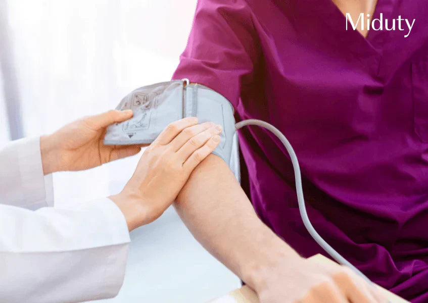 Healthcare professional measuring blood pressure on a patient's arm