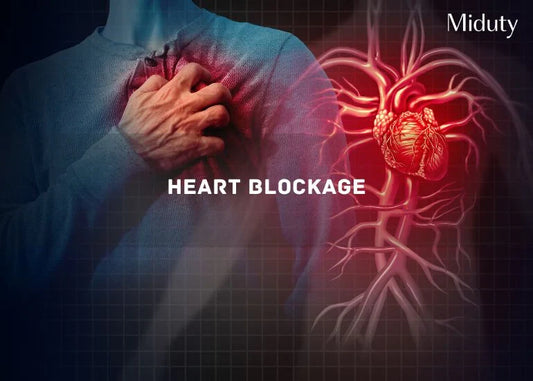 Person holding their chest with a visual of heart arteries and blockage