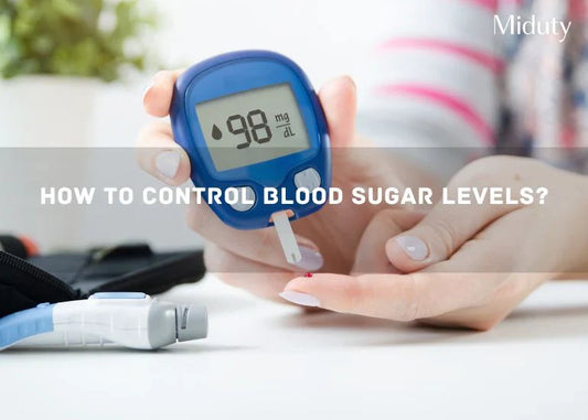 Person testing blood sugar with a glucometer showing 98 mg/dL