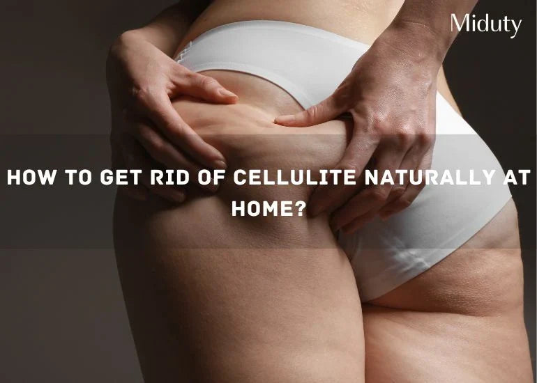Person holding their thigh to show cellulite, wearing white underwear