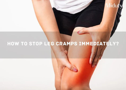 Person holding their leg in discomfort due to a cramp