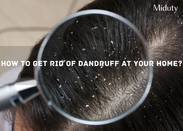 Close-up view of a scalp showing dandruff flakes under a magnifying glass.
