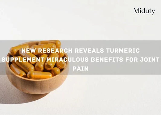 Bowl of turmeric capsules on a plain background