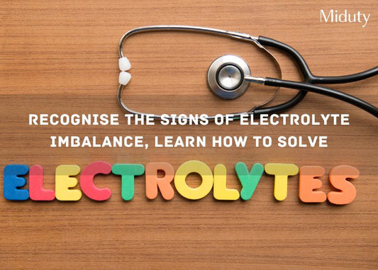 Colorful letters spelling 'ELECTROLYTES' with a stethoscope on a wooden table