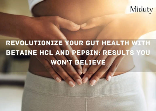 Person gently holding their stomach, suggesting digestive health focus.