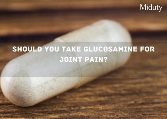Glucosamine capsule on a wooden surface