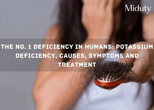 Person holding a hairbrush with hair strands on it, signifying hair loss issues
