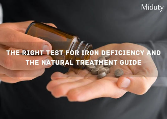 Person pouring iron supplement pills from a bottle into their hand.
