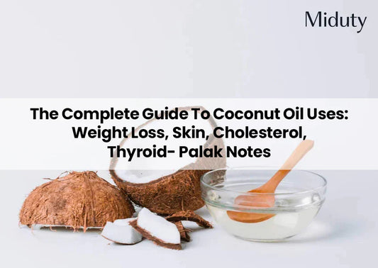 Coconuts and a bowl of coconut oil with a wooden spoon