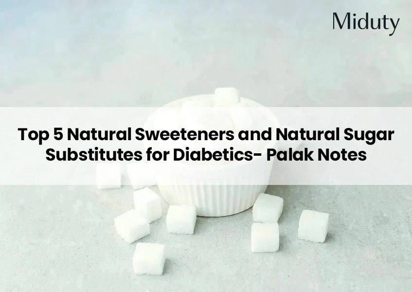 White sugar cubes next to a small white bowl on a gray surface.