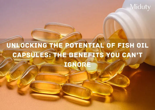 Transparent fish oil capsules scattered near a white bottle on a reflective surface.