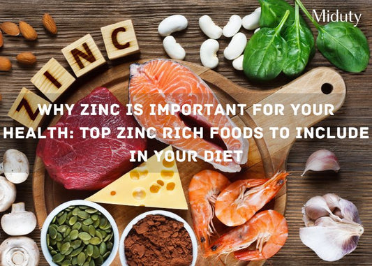 Assorted zinc-rich foods including meat, cheese, seafood, nuts, and vegetables on a wooden cutting board.