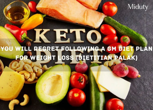 Colorful assortment of vegetables, fruits, nuts, and a piece of fish on a black surface